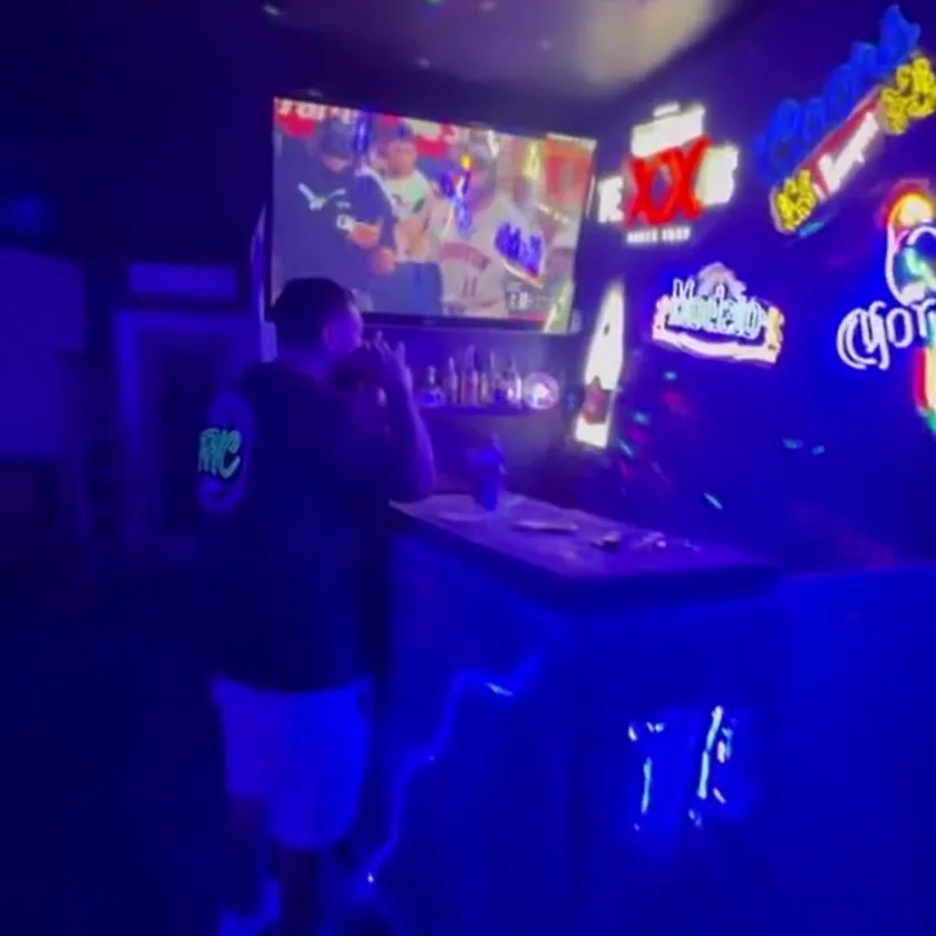 The lounge at The Heights Cutter, neon signs and big screens