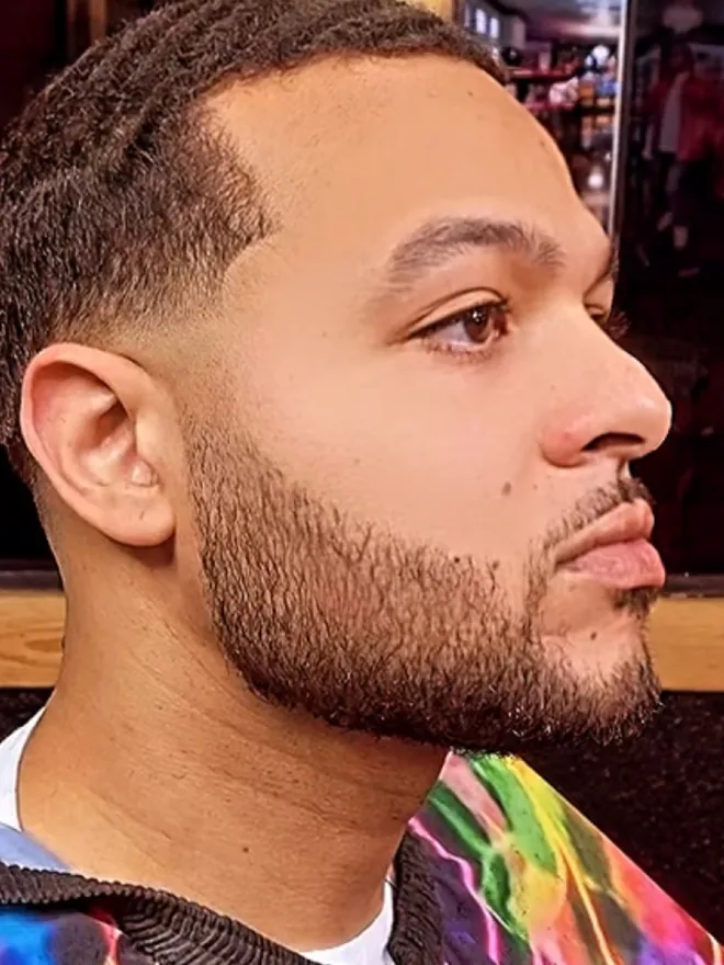 Clean beard fade, profile view