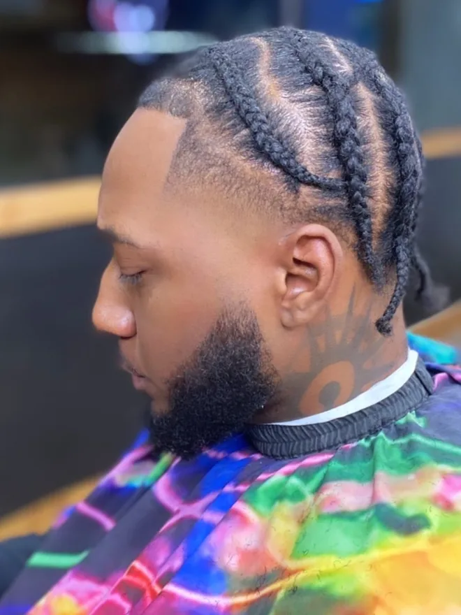 Braids with a full beard and sharp edge-up