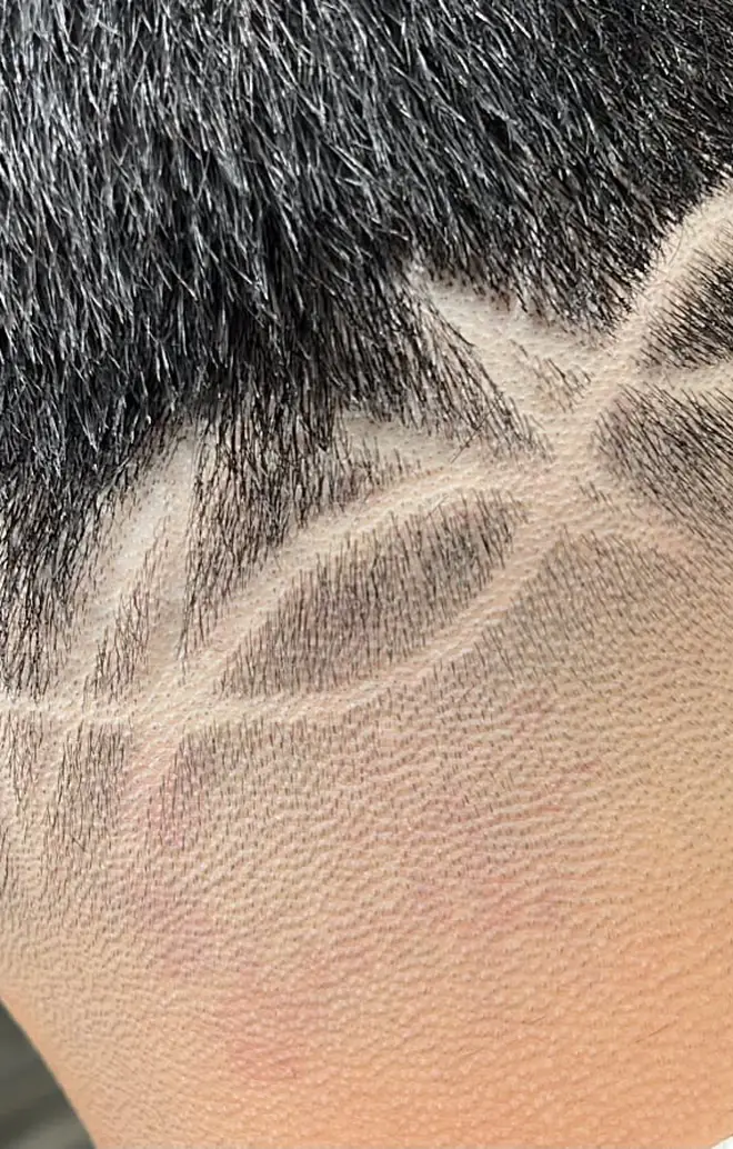 Neckline hair design with a crisp razor line-up